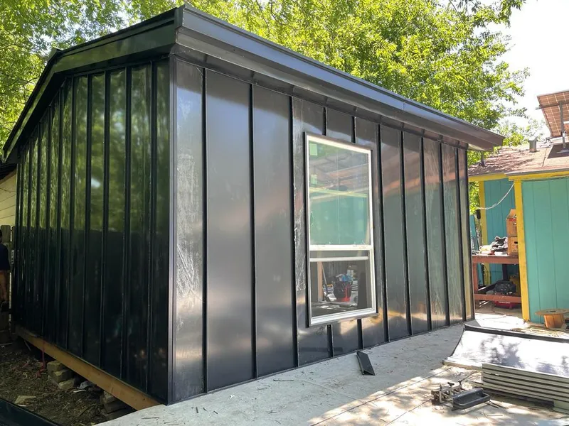 Black standing seam metal wall panels for Roof Inspection in Elmwood Park